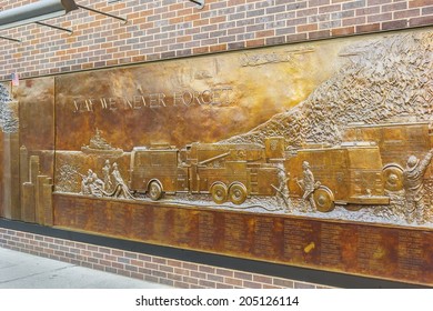 NEW YORK, NY - JUNE 23, 2014: The Memorial Wall, Located At FDNY Engine 10 Ladder 10, Directly Across From The World Trade Center Site.  It's Dedicated To The 343 Members Of The NYFD Who Died On 9/11.