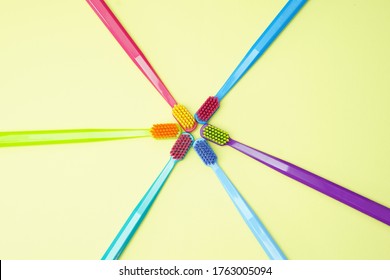 NEW YORK, NY - JUNE 24, 2020: Multi-colored ultra soft toothbrushes aligned in a sun format - Shutterstock ID 1763005094