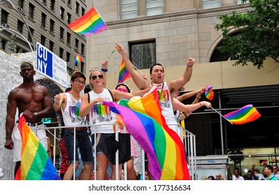 New York, NY- June 30, 2013:  Riders On The CUNY Float Waving Rainbow Flags At The Annual Gay Pride Parade On Fifth Avenue