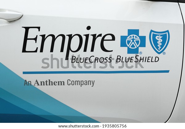 New York, NY - March 10, 2021: car door showing\
the name and logos or health insurance providers Empire Blue Cross\
Blue Shield