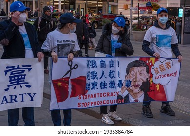 NEW YORK, NY – MARCH 13: Pro Chinese Democracy Activists Holds Banners During A China Democracy Party Demonstration At Times Square On March 13, 2021 In New York City.