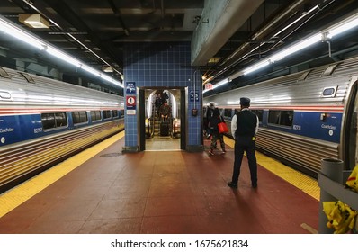 NEW YORK, NY - MARCH 14, 2020: Handful of travelers arrive on platform to board Amtrak train (Vermonter) as caronavirus fears and precautions result in few passengers at Penn Station.