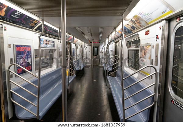 New\
York, NY - March 23, 2020: Virtually empty subway car in New York\
City on first day of Stay at Home executive\
order