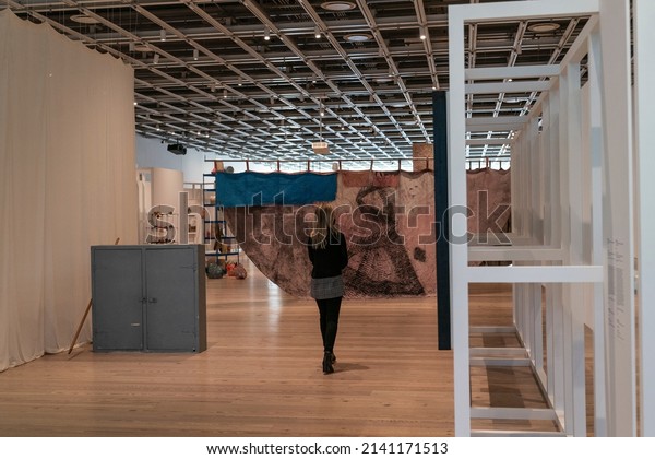 New York, NY - March 29, 2022: A visitor seen viewing\
art installations during press preview at Whitney Museum of\
American Art