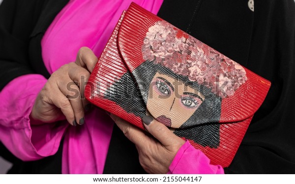 New York, NY - May 10, 2022: Rebecca Moses\
(bag detail) attends Breast Cancer Research Foundation pink party\
at The Glasshouse