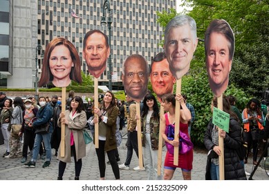 New York, NY - May 3, 2022: Demonstrators Hold Signs With The Faces Of SCOTUS Justices At An Abortion Rights Rally At Foley Squarea