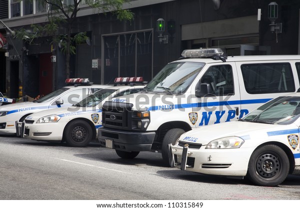 NEW YORK, NY - MAY 30: NYPD police cars parked in\
front of a police station in New York City on May 30, 2011.  The\
NYPD is one of the oldest police departments in the US established\
in 1845.