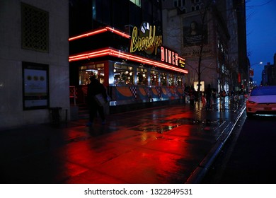 New York, NY; Nov 2018 - Midtown Manhattan's Brooklyn Diner's neon lights shine brightly in the night. 