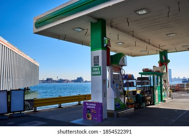 New York, NY - November 9 2020: A Gas Station On The East River At 23rd St In Manhattan, NYC, Across The River Is The Shoreline Of Greenpoint, Brooklyn, NY On A Cloudless Autumn Day