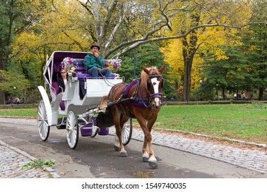 New York, N.Y. - Oct 28, 2019: Iconic to the history of Manhattan, horse drawn carriage rides are one of the most picturesque and romantic ways to see New York's Central Park.