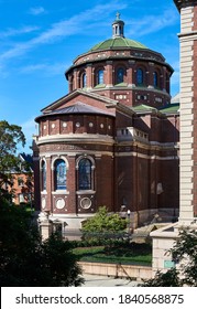 New York, NY - October 15, 2020: The Exterior Of Columbia University's St. Pauls Chapel (1907), Looking Toward The Apse. It Clad In Red Brick And Limestone With A Dome, Pierced By 16 Arched Windows. 