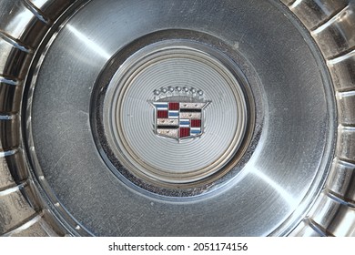 New York, NY - October 2, 2021: Vintage 1980s Cadillac car hubcap with shield and crown logo