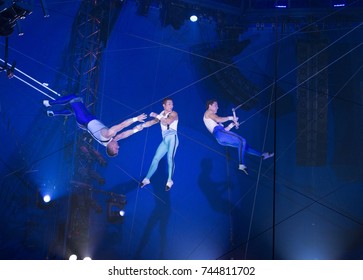 New York, NY - October 29, 2017: Ammed Tuniziani, Adriano DeQuadra, Mauricio Navas performs Flying Trapeze act at Big Apple Circus opening night at Lincoln Center Damrosch Park