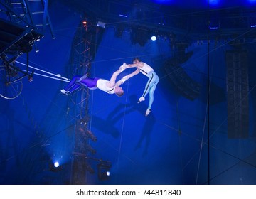 New York, NY - October 29, 2017: Ammed Tuniziani, Adriano DeQuadra performs Flying Trapeze act at Big Apple Circus opening night at Lincoln Center Damrosch Park