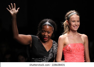 NEW YORK, NY - SEPTEMBER 07: Designer Tracy Reese (L)and model walks the runway at Tracy Reese during Mercedes-Benz Fashion Week Spring 2015 at Art Beam on September 7, 2014 in New York City.