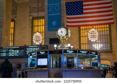 NEW YORK, NY - SEPTEMBER 11: Iconic clock in Grand Central Terminal with American Flag in background of New York City, New York on September 11, 2018.