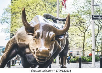 New York, NY / United States - May 2 2020: Wall Street Stock Exchange Charging Metal Bull In NYC Manhattan Lower Financial District