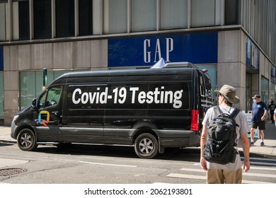 New York, NY, US- August 25, 2021: Mobile Covid-19 Testing Van Parked Along Busy Street In City As People Walk Quickly By.