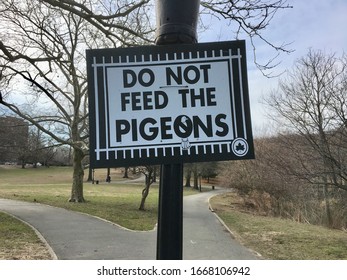 New York, NY / USA - 3-8-20: NYC Parks “Do Not Feed The Pigeons” Sign, Inwood Hill Park, Manhattan