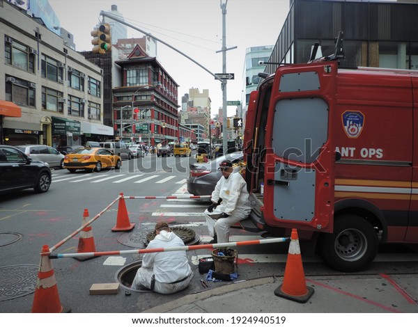 New York, NY, USA - 6-72017: men working in the\
streets of New York