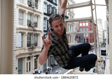 New York, NY USA April 18 2018: Athlete Climbing Fire Escape In SoHo, NY