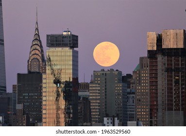 New York, NY, USA - April 26, 2021: Pink Supermoon Rises Over NYC