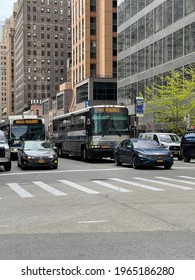 New York, NY  USA - April 10, 2021: New York City Buses On Streets Of Midtown Manhattan