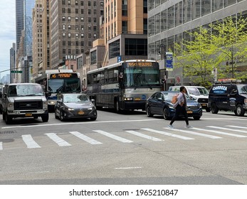 New York, NY  USA - April 10, 2021: New York City Buses On Streets Of Midtown Manhattan