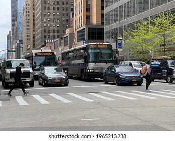 New York, NY  USA - April 10, 2021: New York City Buses On Streets Of Midtown Manhattan