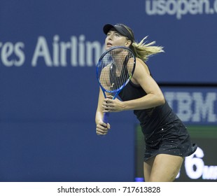 New York, NY USA - August 28, 2017: Maria Sharapova of Russia returns ball during US Open Championships day match against Simona Halep of Romania at Billie Jean King Tennis center