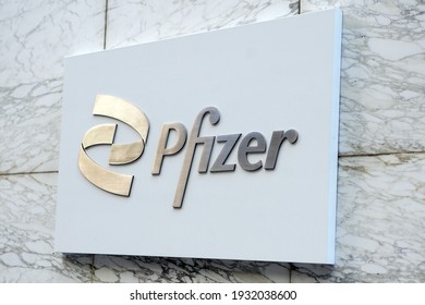 New York, NY USA - A building sign in midtown Manhattan for pharmaceutical company Pfizer, maker of a coronavirus COVID-19 vaccination.