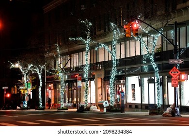 New York, NY USA - December 17, 2021: The World Famous Fashion Boutiques And Designer Shops On Madison Avenue Decorate Their Storefront Windows With Colorful Christmas Themed Decorations Each Winter.