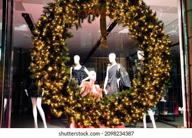 New York, NY USA - December 17, 2021: The World Famous Fashion Boutiques And Designer Shops On Madison Avenue Decorate Their Storefront Windows With Colorful Christmas Themed Decorations Each Winter.