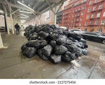 New York, NY USA - February 10, 2022: New York City, Garbage Bags Left On City Sidewalk