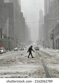 New York, NY USA - February 1, 2021:New York City,  Man Crossing Street During Nor’easter Snow Storm