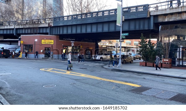 New York, NY, USA - February 18, 2020:A small\
diner which rests comfortably under the westside Highline in the\
Meat Packing District