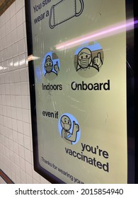 New York, NY  USA - July 18, 2021: New York City, New York Subway Cracked Ad Screen With Covid-19 Mask Mandate Notice