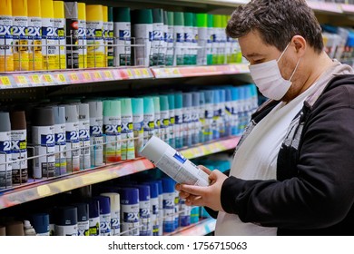 New York, NY USA - JUNE 14, 2020: A Man Wearing A Protective Mask In Store During The COVID 19 Pandemic Chooses Paint To Paint In The Store