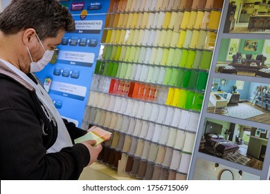 New York, NY USA - JUNE 14, 2020: A Man Wearing A Protective Mask In Store During The COVID 19 Pandemic Chooses Paint To Paint In The Store