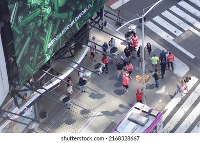 New York, NY USA - June 9, 2022: New York City, Pedestrians Overhead In Times Square Crossing Street