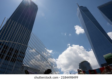 New York, NY, USA - June 4, 2022: One World Trade Center (right) And Top Of The Ribs Of The Oculus Of The World Trade Center Transportation Hub.