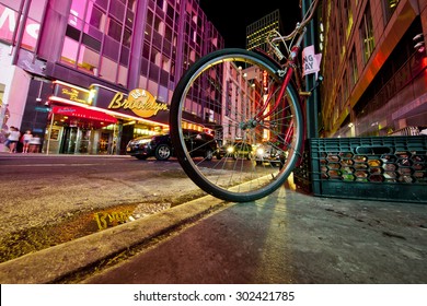 NEW YORK, NY, USA - June 12, 2015: Low angle of New York's busy 42nd Street off Times Square showing a bike and the Brooklyn Diner