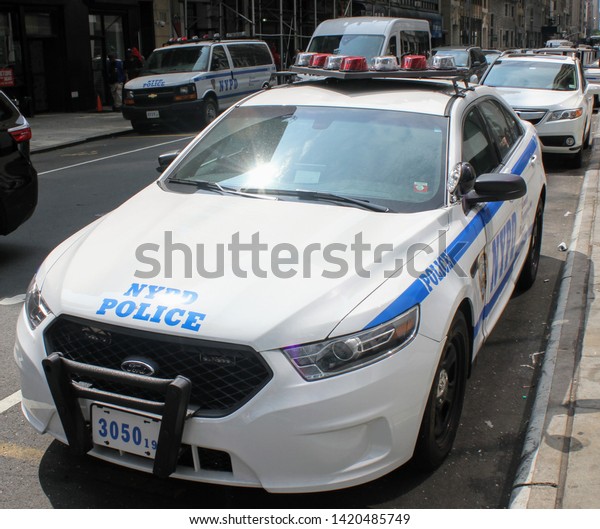 New York, NY / USA - June 5, 2019 : NYPD Police\
Car Parked in Mid-Town\
Manhattan
