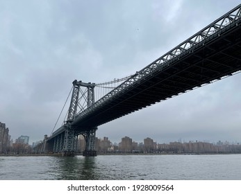 New York, NY  USA - March 1, 2021: New York City, Williamsburg Bridge from the East River