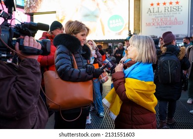 New York, NY USA - March 2 2022: Old Woman With Ukraine Flag Giving Interview For TV At The Protest Against Russia War In Ukraine At Times Square