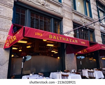 New York, NY, USA - March 13, 2022: Red Awning And Outdoor Seating For Balthazar, A Popular French Restaurant And Bakery In New York City, USA