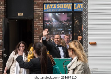 New York, NY / USA - May 20, 2015: Jerry Seinfeld waves to the crowds outside the Ed Sullivan Theater after his appearance on the final episode of Late Night With David Letterman.