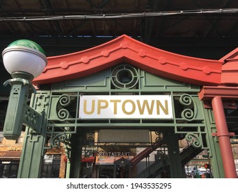 New York, NY USA - November 29, 2018 : Uptown sign in front of a subway entrance in Inwood, Upper Manhattan