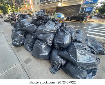 New York, NY USA - November 1, 2021: New York City, Garbage Bags Left On City Sidewalk 