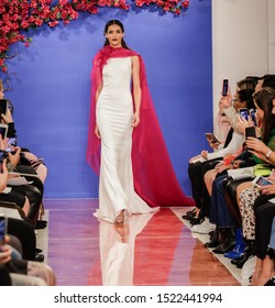 NEW YORK, NY, USA - October 3, 2019: A model walks the runway at the Theia Fall 2020 collection during New York Bridal Week at the Theia Showroom, Manhattan